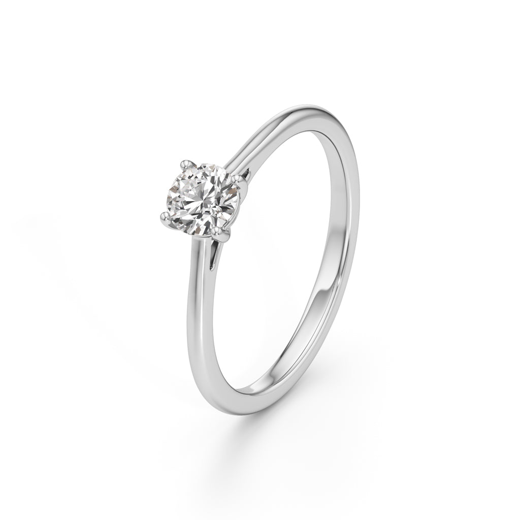 Solienara four prong round cut solitaire ring