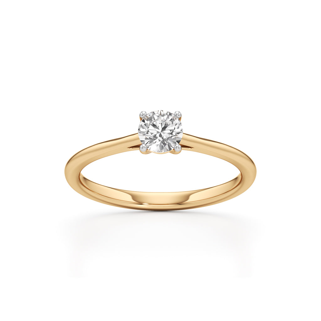 Solienara four prong round cut solitaire ring
