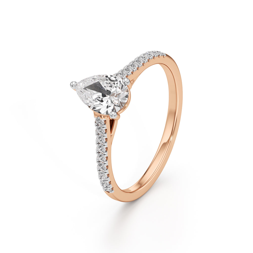 Teardrop Grace – 0.71 Ct Pear Shape Side Stone Ring