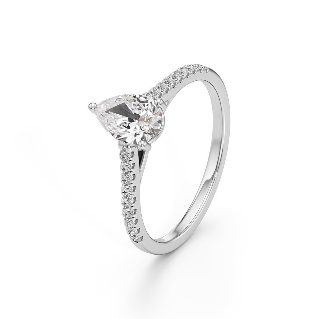 Teardrop Grace – 0.71 Ct Pear Shape Side Stone Ring